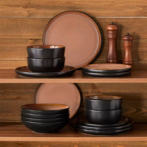 Assorted dishes with soup - dessert - and fruit salad on rustic wooden table - Amber 16-Piece red stoneware dinnerware set with plates and bowls by vancasso