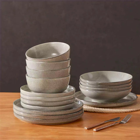 Handcrafted brown stoneware with reactive glaze on woven placemats - perfect for farmhouse tables