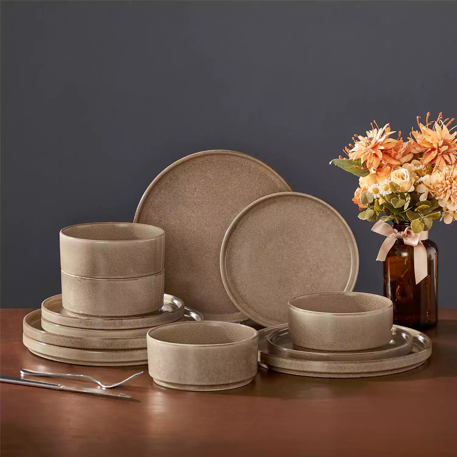 Anya 12 piece straight edge stoneware dinner set in caramel with food on a rustic farmhouse wooden table with a side salad and cutlery