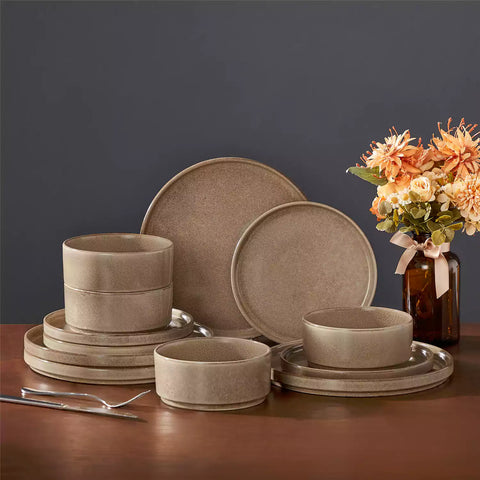 Anya 12 piece straight edge stoneware dinner set in caramel with food on a rustic farmhouse wooden table with a side salad and cutlery
