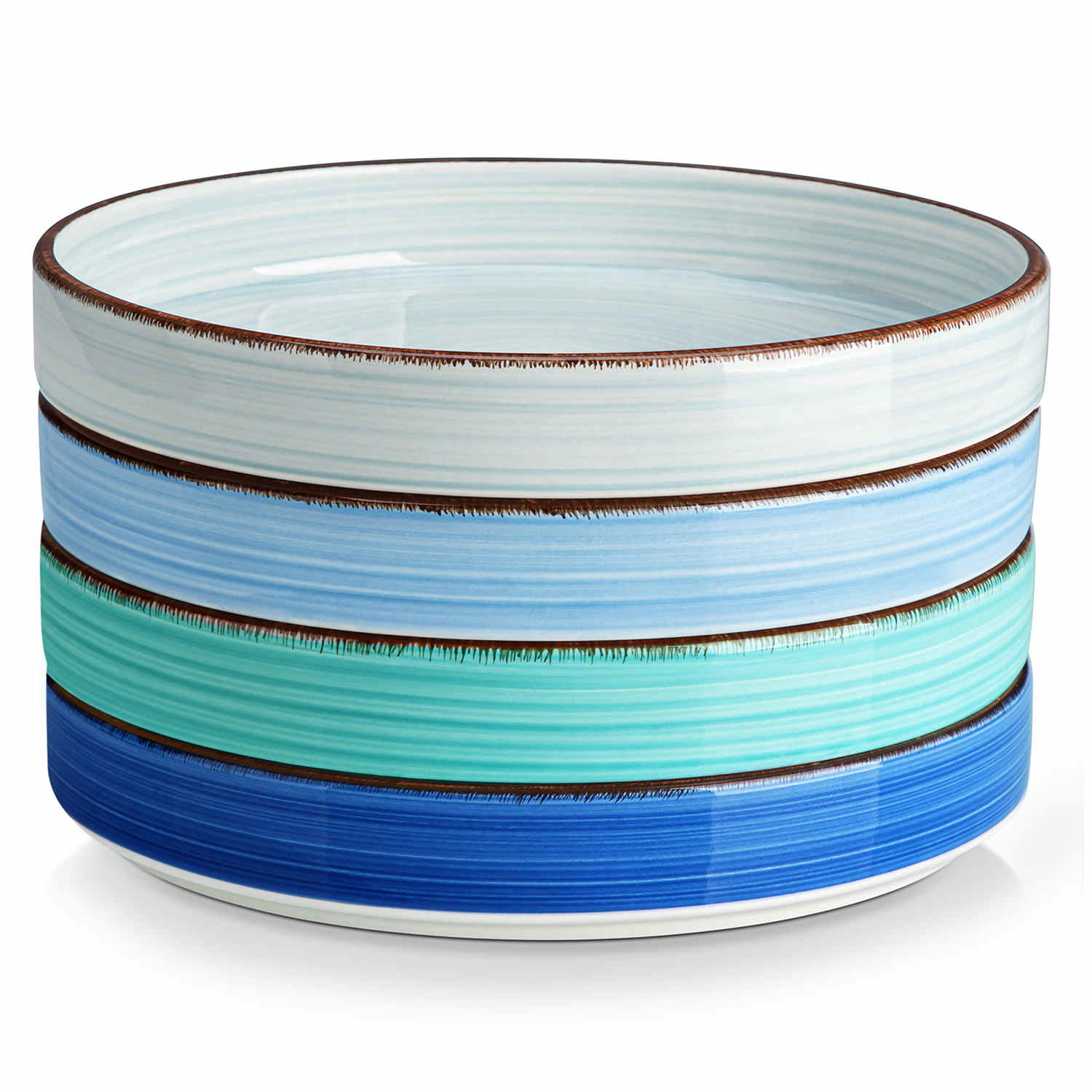 Bonita straight-edge pasta bowls set of 4 on a white table - filled with spaghetti - fruit salad - and mango - accompanied by a small honey jar - ibrant stoneware in ocean blues