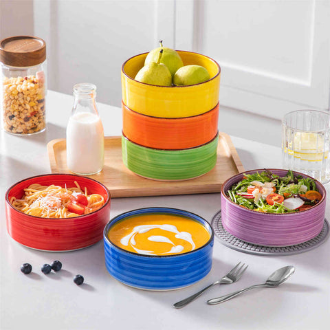 Multicolor Bonita straight-edge cereal bowls set of 6 on a white table - filled with oats - pear - and pasta - accented with lemons and greenery for a fresh - natural look