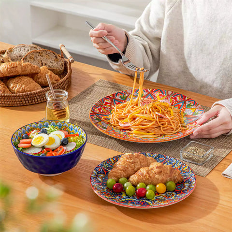 Bohemian Lumi 12 piece porcelain dinnerware set with vibrant patterned plates diamond embossed bowls served with steak eggs and fresh fruit on a wooden table