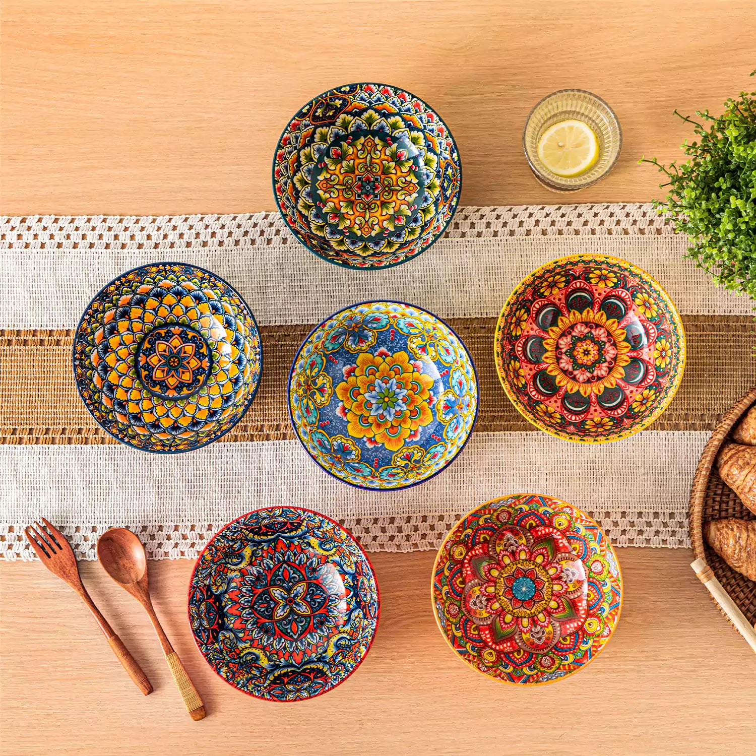 Colorful 26oz Lumi porcelain bowls on rattan placemats filled with oatmeal berries roasted broccoli and cherries on a linen table runner