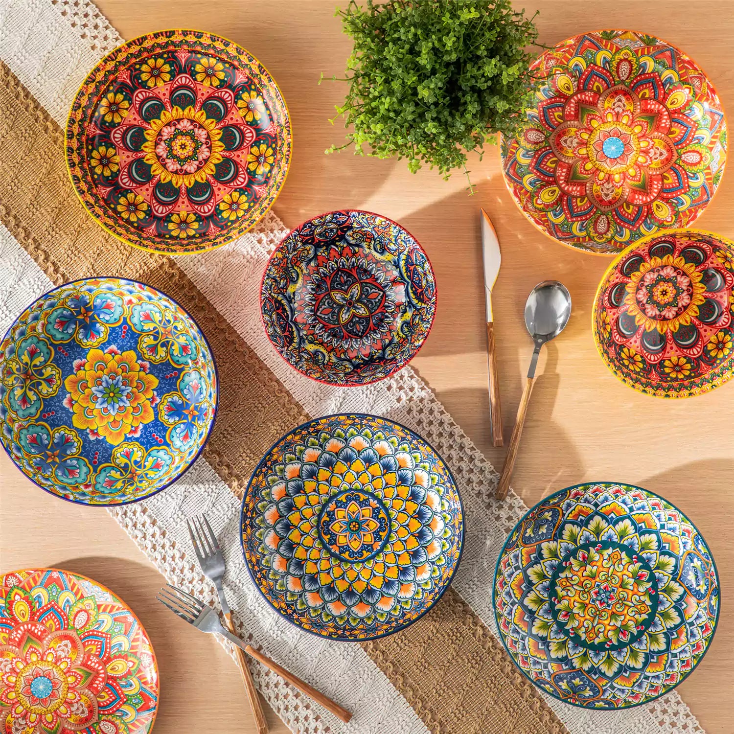 Vibrant Boho pasta bowls on a wooden table filled with pasta cherries and persimmons for a colorful, casual dining setting