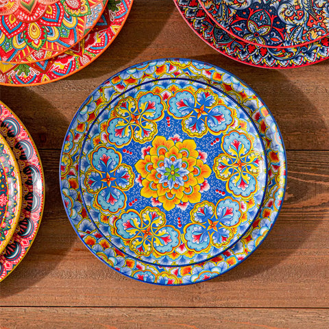 Bohemian Lumi 16 piece porcelain dinnerware set with colorful patterned plates and diamond-embossed bowls on a wooden table with assorted food and cutlery