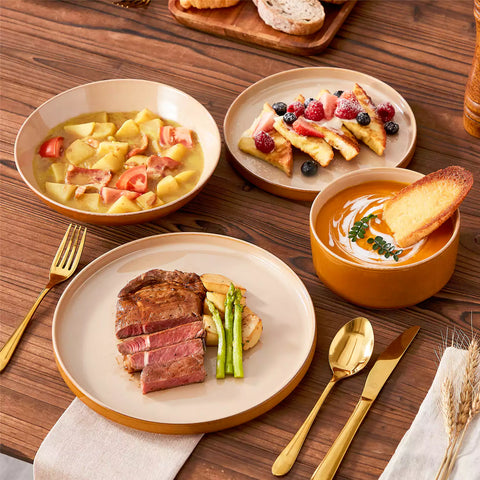 Assorted family dinnerware on wooden table brown stoneware soup bowl pasta with shrimp fruit tart and bread perfect for everyday meals