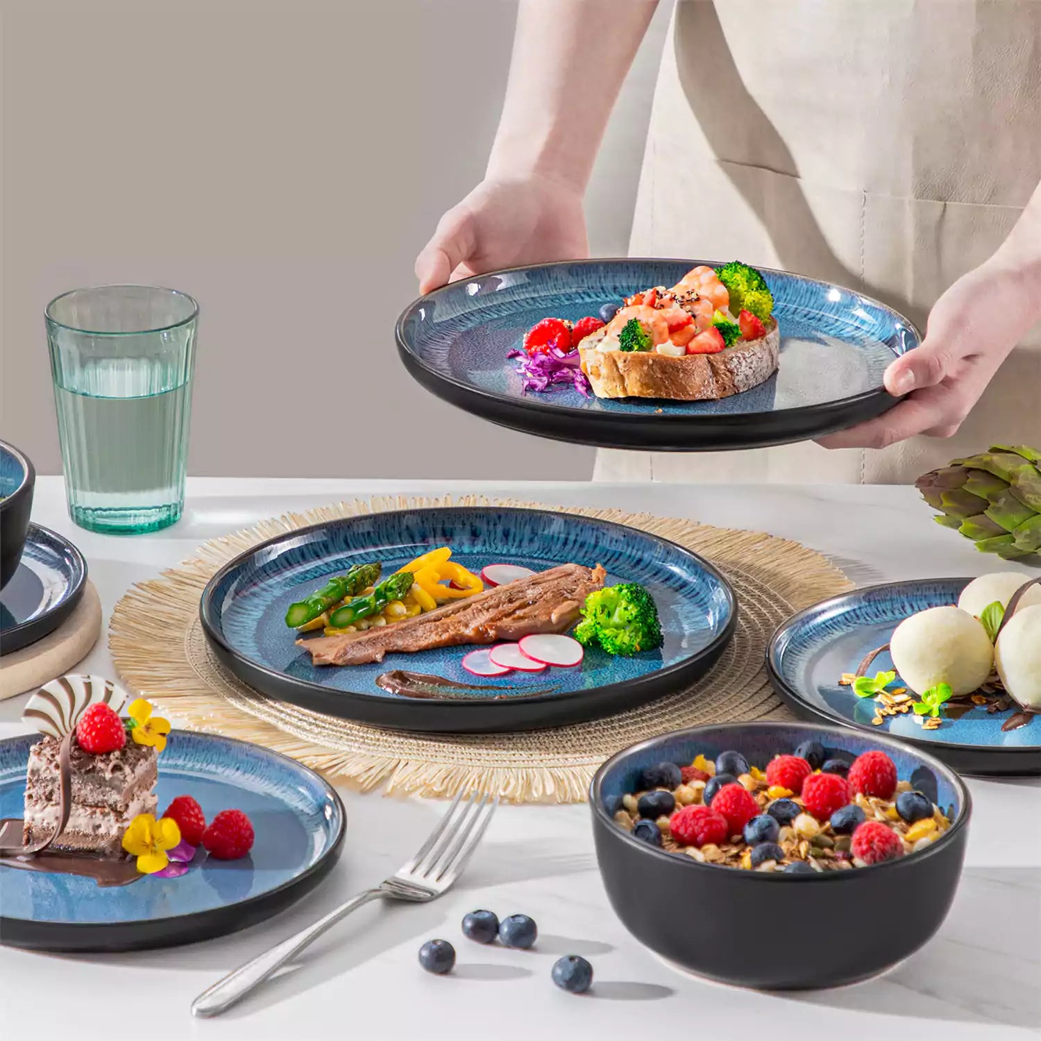 Playa 18-Piece Stoneware Dinnerware Set with plates and bowls for 6 - featuring a unique blue reactive glaze and a farmhouse-inspired style-vancasso