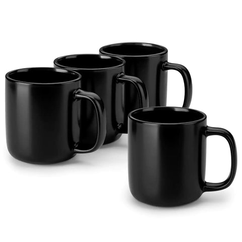 Playa 16oz stoneware mugs in black reactive glaze on a rustic wooden café table with coffee maker and pastries