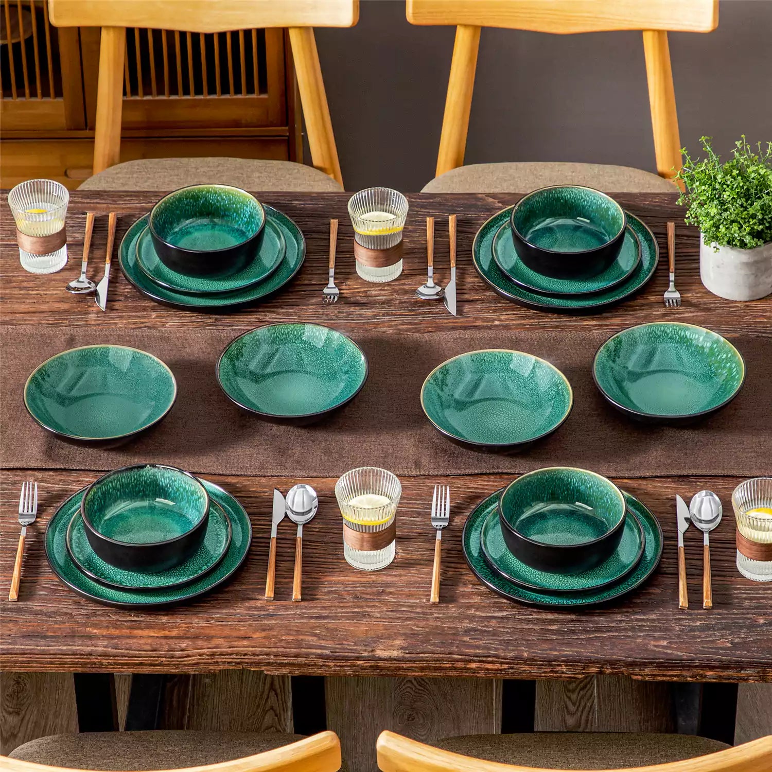 A glossy green 16-piece stoneware dinnerware set from the Playa collection - featuring farmhouse charm with plates and bowls for 4 people-vancasso