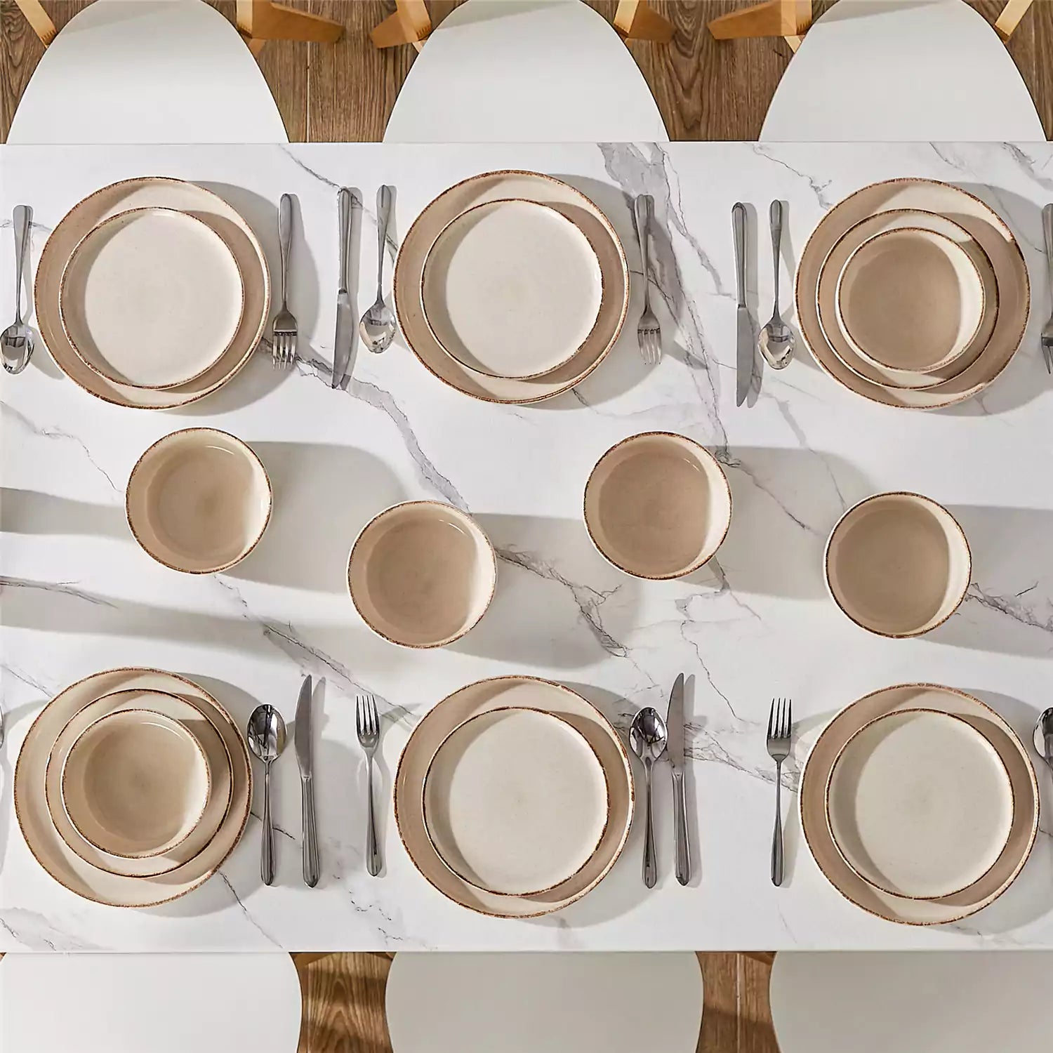 Plays 18-piece stoneware dinnerware set with steak and vegetables on marble table - featuring sandy speckled plates and bowls with brown rims-vancasso
