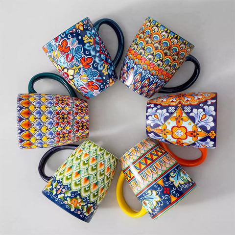 Boho-style coffee mugs filled with creamy latte, colorful porcelain set for cozy mornings