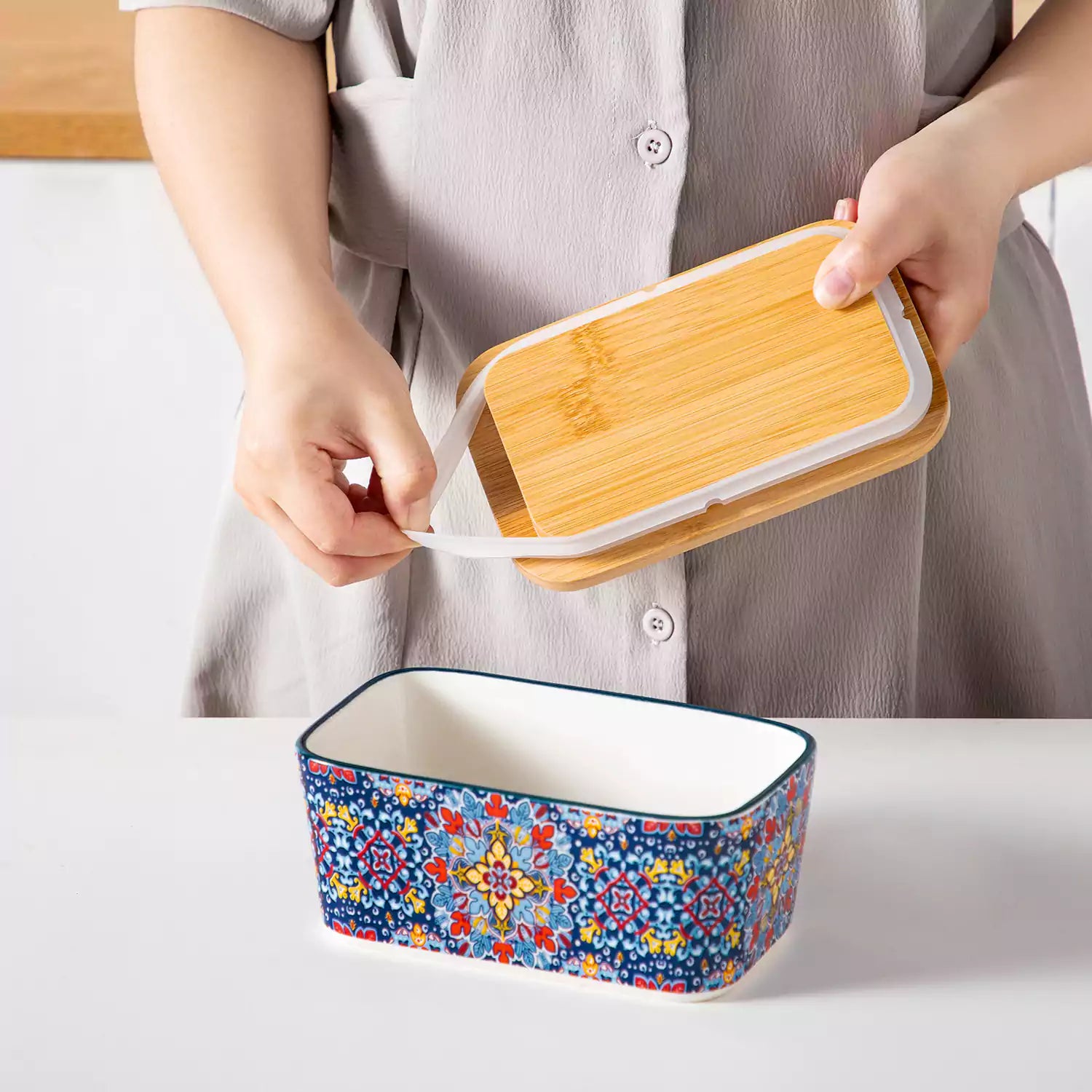 Midnight blue porcelain butter dish with wooden lid in boho chic style - perfect for a colorful breakfast table with bread and coffee-vancasso