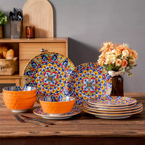 Bohemian-style 12-piece porcelain dinnerware set with front-only floral and geometric patterns in bold orange - modern and artistic table setting