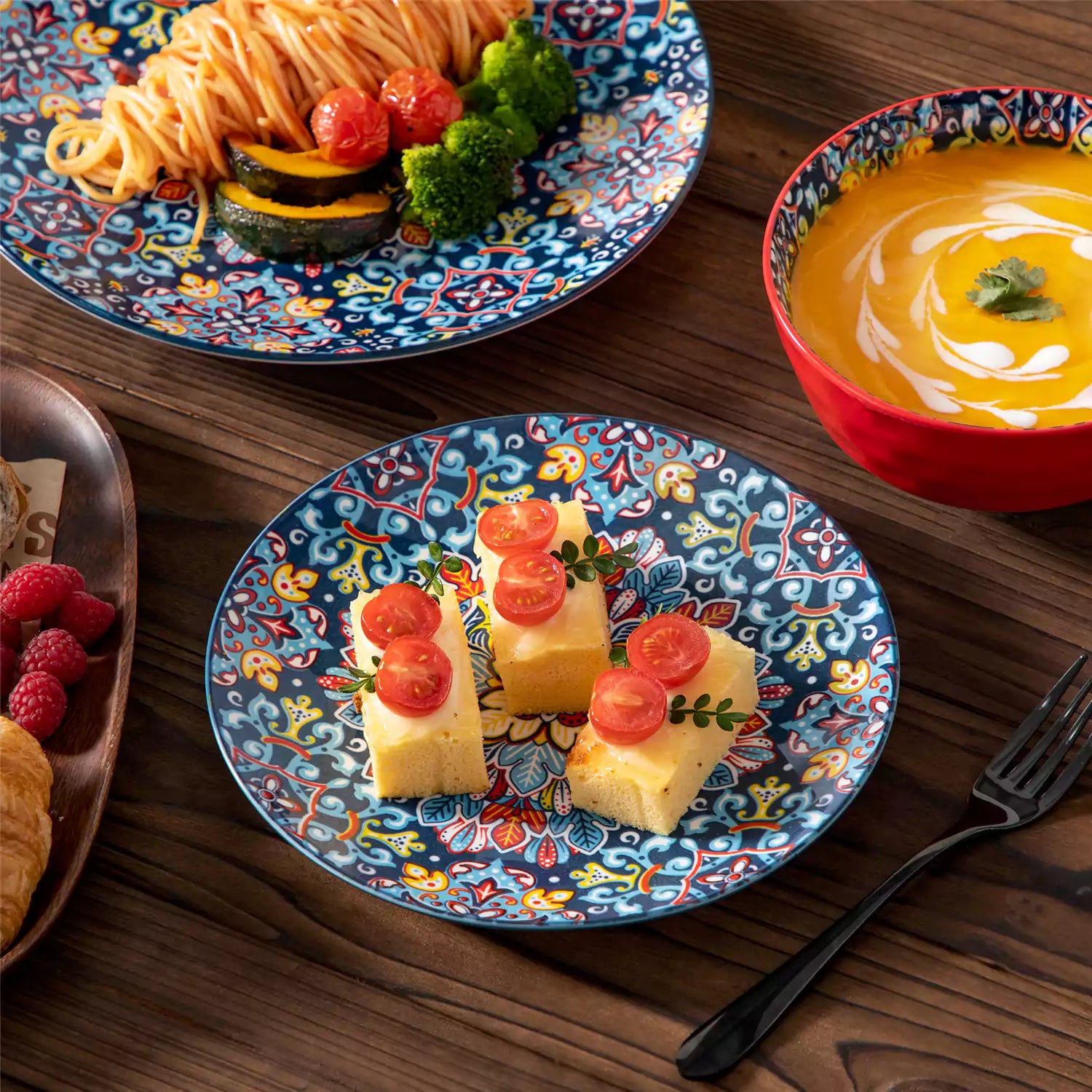Bohemian-style 12-piece porcelain dinnerware set with front-only floral and geometric patterns in vivid red - modern and artistic table setting