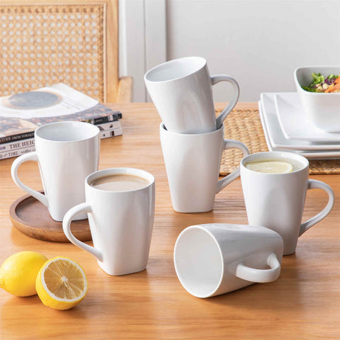A glossy white 24-piece stoneware dinnerware set from the Soho collection - featuring a sleek square design with plates and mugs for 6 people-vancasso