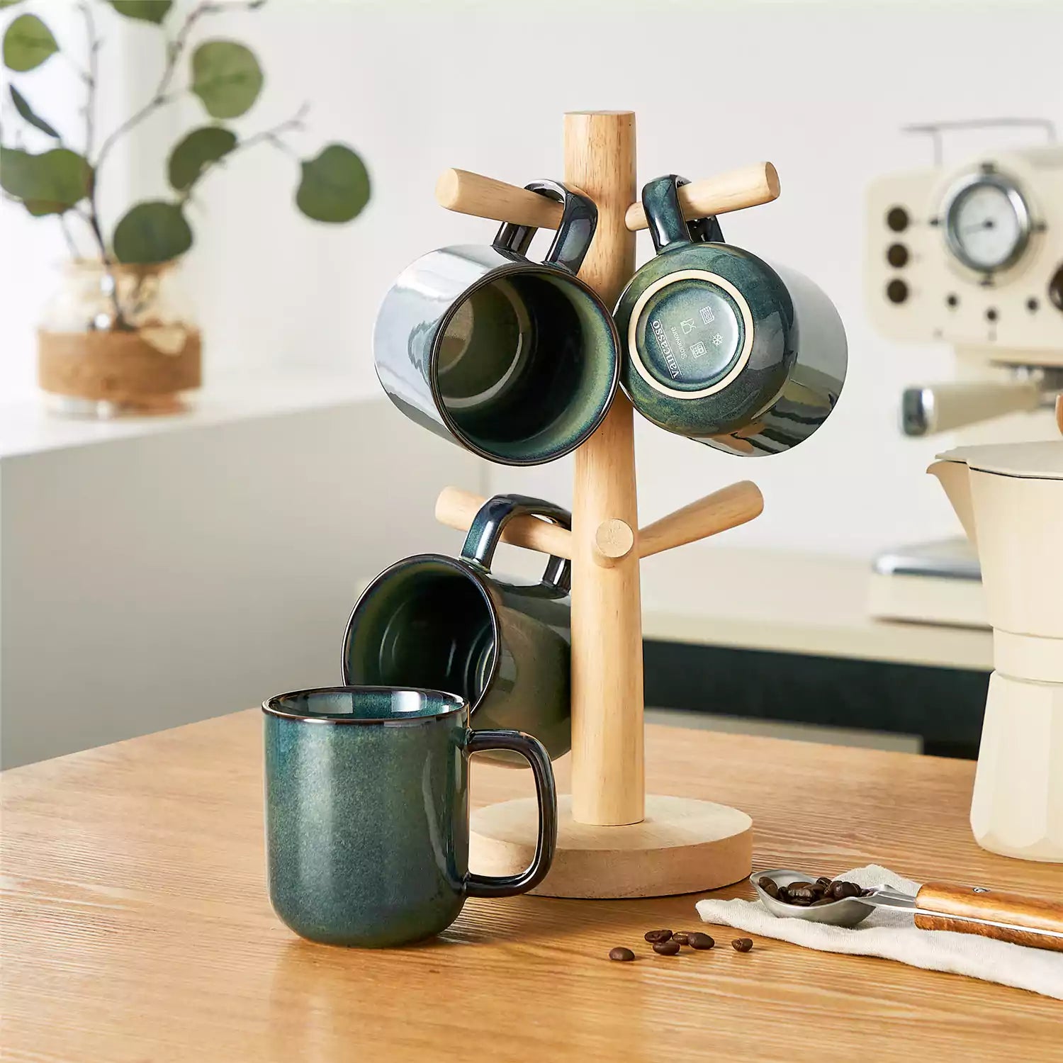 Starry teal 12oz stoneware mugs set of 4 with coffee on wooden table next to coffee maker and fresh bread cozy breakfast scene